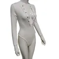 Detailed side view of a white long-sleeved ribbed bodysuit featuring V-neck snap buttons - S / Tops / White