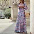 Detail of a vibrant pink and blue paisley print bohemian maxi dress with tiered hem. - S / Top And Bottom / Pink