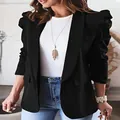 Detail view of women's black long sleeve blazer with puff pleated shoulders - S / Tops / Black