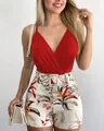 Close-up of red V-neck camisole and floral print high-waisted shorts with belt. - S / Red