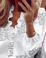Detailed view of women's white long sleeve ruffled blouse with cursive script print - S / Tops / Letter Print