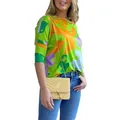 Detail shot of a woman wearing a vibrant geometric print long-sleeved loose-fit T-shirt. - S / Tops / Yellow Stone and Green Leaf