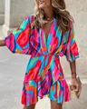 Vibrant abstract print dress with batwing sleeves and ruffled irregular hem for summer. - S / Dresses / Red