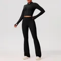 Nauwsluitende zwarte yogaset met jack met rits en uitlopende broek met hoge taille - Zwart