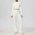 Nauwsluitende witte yogaset met ritsjasje met lange mouwen en uitlopende legging - Wit
