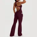 Sleeveless burgundy backless yoga jumpsuit with flared legs and convenient side pocket. - S / Tops / Berry Red