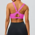 Back view of a bright pink Y-shaped adjustable sports bra featuring high impact support - S / Tops / Rose Pink