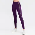 Women's dark purple high-waisted yoga leggings with neon green stitching accents - S / Bottoms / Purple