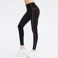 High-waisted black yoga leggings for women with red contrast stitching and fleece lining - S / Bottoms / Black and Orange-Red