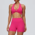 Vibrant pink two-piece yoga set with halter sports bra and high-waisted lifting shorts. - S / Top And Bottom / Peacock Pink