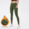 Olijfgroene dames yoga-legging met warme fleecevoering, zijzakken en hoge taille - Legergroen