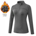 Camiseta deportiva manga larga mujer, gris oscuro, forro polar cálido y cuello con cremallera - Gris Mezcla