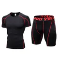 Professionele heren compressie fitness set in zwart met sportieve rode stiksels - Zwart/Rode Naad