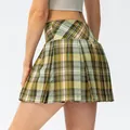 Back view of women's green plaid pleated sports tennis skort for running and yoga fitness - Mustard Yellow Plaid