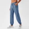 Men's breathable quick-dry blue nylon joggers with textured fabric and elastic cuffs - S / Bottoms / Dark Blue