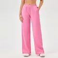 Dames sportbroek met hoge taille en wijde pijpen in roze met een getextureerde stof - Rozerood