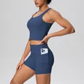 Detail of blue yoga shorts side pocket showing phone storage during fitness training sessions - S / Top And Bottom / Navy Blue