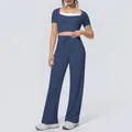 Full view detail of two-piece blue yoga set with halter crop top and wide leg pants - S / Top And Bottom / Navy Blue