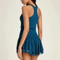 Back view of a breathable teal tennis dress with a racerback and pleated skirt - S / Top And Bottom / Navy Blue