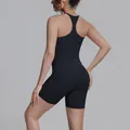 Detail view of black racerback sports tank top and tight biker shorts set - S / Top And Bottom / Black