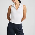 Detailed macro view of the white sleeveless polo-collar sports tank top for women - S / Tops / White