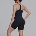 Back view of a black quick-dry yoga set featuring a white-trimmed racerback tank - S / Top And Bottom / Black with White Trim and Black Shorts