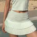 Mint green two-piece athletic set with sleeveless top and double layered pleated skirt. - S / Bottoms / Mint Green