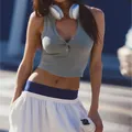 Detail of gray Henley neck cropped sports tank top with buttons on a model - S / Tops / Dark Gray