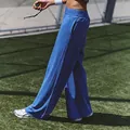 Comfortable blue wide-leg sports pants for women in a natural outdoor athletic setting - S / Bottoms / Blue