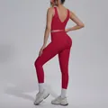 Back view of a red two-piece yoga set featuring a V-neck sports bra and seamless leggings - Rouge Red