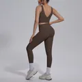 Rear view of women's brown yoga set with V-neck sports bra and high waist leggings - Distilled Coffee