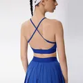 Women's royal blue backless cross-strap sports bra and matching pleated tennis skirt - S / Tops / Dark Blue