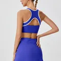 Back view of blue high-waist tennis skirt and cutout sports bra set - S / Tops / Vitality Cobalt Blue