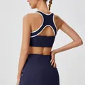 Navy blue athletic set with back-cutout sports bra and high-waist tennis skirt - S / Tops / Azure Gray