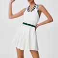 Sporty white pleated tennis dress featuring green contrast waistband and front zipper - S / Top And Bottom / Green