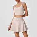 Ensemble de sport avec brassière à fines brides et jupe de tennis plissée rose clair - S / Haut et Bas / Abricot Lacté