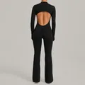 Elegant black long sleeve backless yoga jumpsuit featuring flared pants for fitness wear - S / Top And Bottom / Black