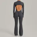 Dark grey long sleeve backless yoga jumpsuit featuring a stand-up collar and flared leg style - S / Top And Bottom / Charcoal Gray