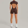 Back view of a brown open back sports bodysuit featuring scrunch butt design for yoga - Brown