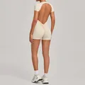 Beige backless one-piece yoga romper with short sleeves and scrunch butt detail for women. - Beige