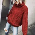 Detailed view of women's vibrant red turtleneck cable-knit sweater for autumn winter fashion - Red