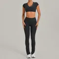Two-piece grey brushed yoga set featuring short sleeve top and flared button leggings - S / Top And Bottom / Charcoal Gray