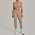 Taupe two-piece yoga set with zipper front sports bra and high-waisted leggings for gym - Flaxen