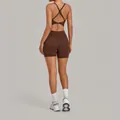 Back view of a sleek brown cross-back yoga bodysuit for athletic training and fitness - S / Top And Bottom / Coffee