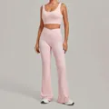 Two-piece light pink yoga set featuring a sports bra and crossover flare leggings. - S / Top And Bottom / Ballet Powder