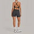 Athletic dark grey one-piece yoga jumpsuit with adjustable criss-cross back and cutout - Charcoal Gray
