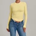 Slim fit long sleeve yellow yoga top for high-impact fitness and Pilates workout - Durian Yellow