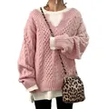 Detail view of pink cable knit women's sweater with soft texture and layered design - S / Tops / Pink