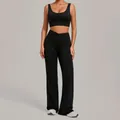 Professional black two-piece yoga set featuring sports bra and crossover flare leggings - Black