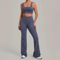 Two-piece slate blue yoga set featuring a supportive sports bra and flared high-waist pants - Granite Blue